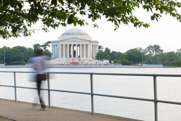 Jefferson Memorial and silhouettes of runners in motion blur  - Washington DC United States