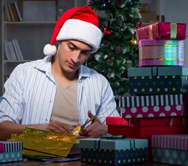 Man with many christmas gifts in boxes
