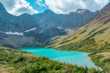 Fototapeta na wymiar The stunning turquoise Cracker Lake in Glacier National Park, Montana, USA