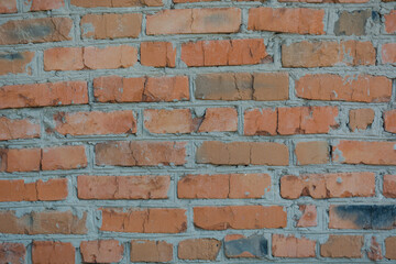 Brick wall. Brick background. Red brick. Close-up of the wall. Masonry. Cement-based bricks. Home construction.