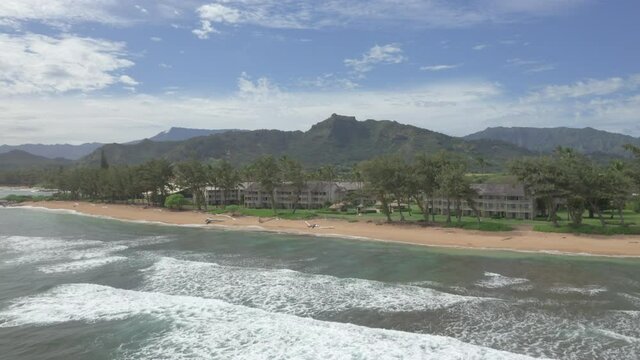 Kauai Aerial Beach sinking shot to reveal shore and waves