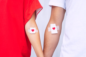 Blood donation. Blood donors with bandage after giving blood - obrazy, fototapety, plakaty
