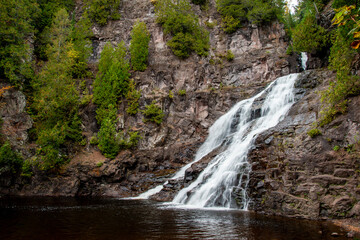 Beautiful Caribou Falls flowing down on the Caribou River in the fall in the Superior National forest