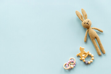 Baby toy rabbit with wooden accessories, overhead view