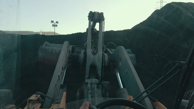 Digger operator, pov, Excavation work in construction work, coal mine scoop work