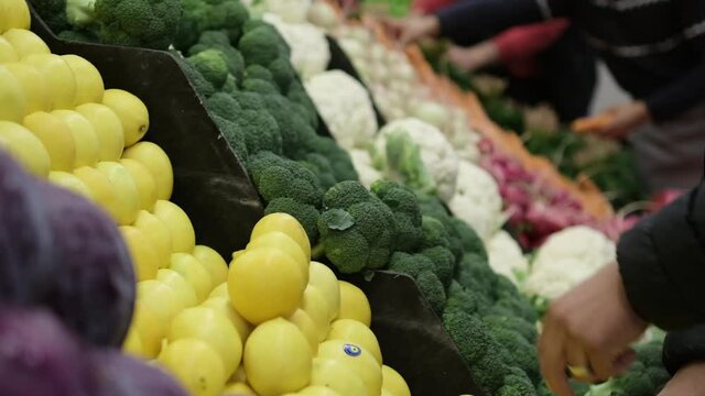 greengrocer organizes the market stall