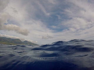 On the blue ocean surface of waves in Maui, Hawaii