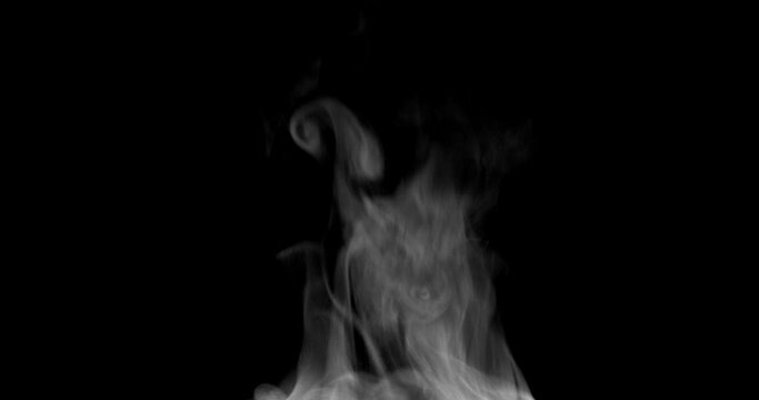 White Steam Ascends Over the Pan. White Steam rises from a large pot that is behind the scenes. Black background. Steam for Food.
