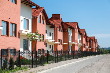 Fototapeta na wymiar View of modern town cottages on sunny day