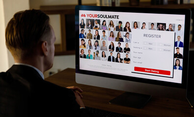 Businessman browsing online dating website