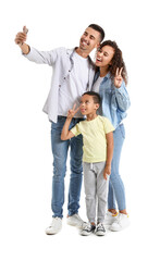 Happy interracial family taking selfie on white background