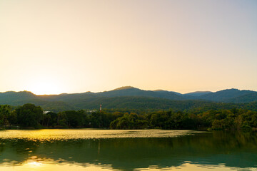 Fototapeta premium Ang Kaew lake at Chiang Mai University with forested mountain