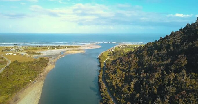 Drone View From Above of Mokihinui River and the Pacific Ocean in New Zealand  with Gentle Annie's Camping Ground - Dolly Shot
