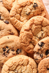 Tasty homemade cookies with chocolate chips on table, closeup