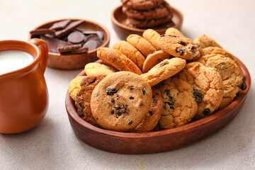 Tray with tasty homemade cookies on light background