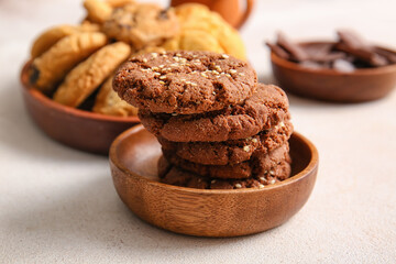 Bowl with tasty chocolate homemade cookies on white background