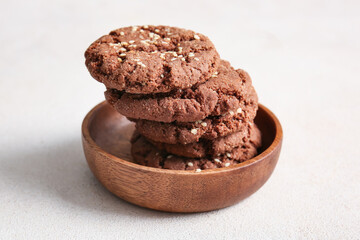 Bowl with tasty chocolate homemade cookies on white background