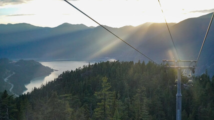 Sunset water mountain view to Gondola cable 