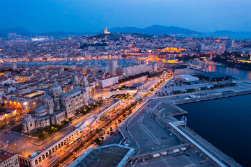 Fototapeta na wymiar Bird's eye view of Marseille at dusk. Marseille Cathedral visible from above.