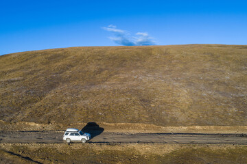 Driving off road car explor the  winter landscape in tibet, China