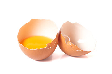 half broken egg and yolk isolated on white background with clipping path.