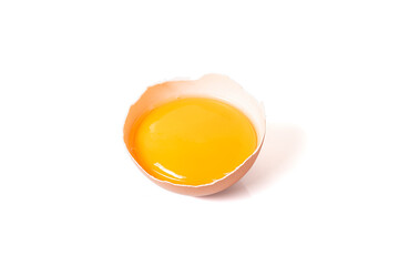 half broken egg and yolk isolated on white background with clipping path. - obrazy, fototapety, plakaty