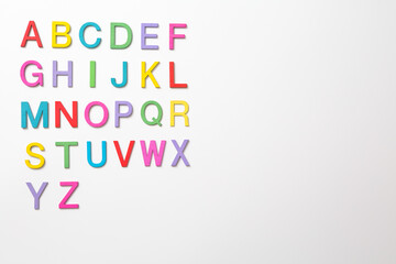 Colorful wooden english letters A-Z on white background