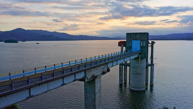 Hatillo dam pump station; slow drone dolly out during sunset