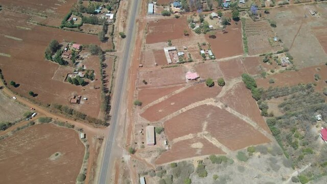 High angle tilt up of farms in a beautiful Kenyan landscape