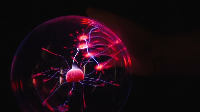 The energy inside the plasma ball sticking on the hands outside then spreads after getting off the hands in Estonia