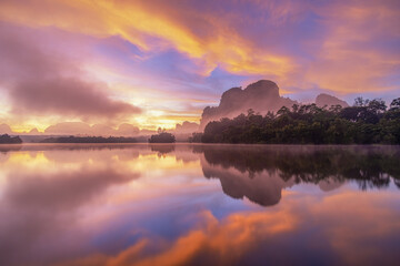 Beautiful nature reflection on water at sunrise time, Ban Nong Thale, Krabi province, Thailand