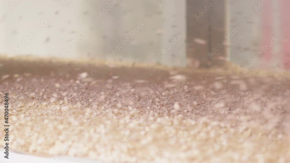 Poster oats are flying around in a machine that heats them up to dry after they have been steamed and flatt