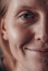 middle aged old woman looking at camera isolated on white background advertising dry skin care treatment anti age skincare beauty, plastic surgery, cosmetology procedures. Close up half face view