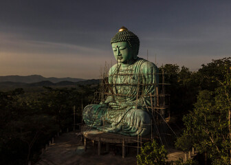 The "Great Buddha" (Daibutsu) bronze statue at the Wat Doi Phra Chan-in Buddhist temple in the city of Mae Tha in Lampang Prefecture, Thailand