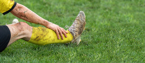 Soccer, football concept. Injured footballer lay down on field.