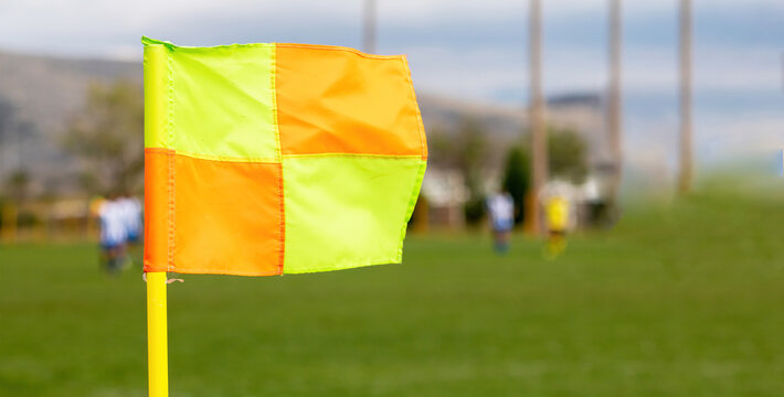 Football, soccer game flag. Blurred background