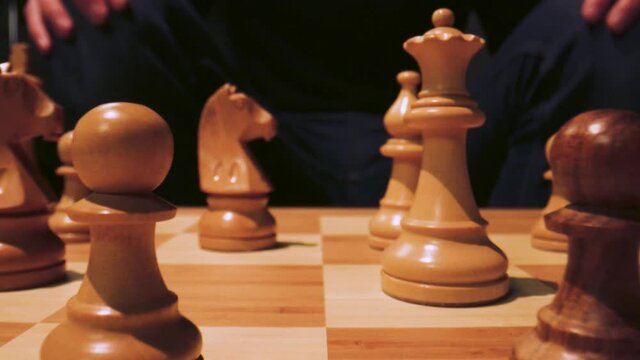 Slide through a chessboard as if it was giant with a macro lens. The knight takes the pawn.