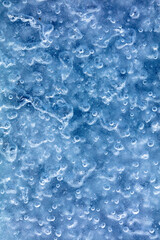 Blue crystals of snow and ice as an abstract background.