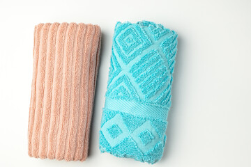 Clean colored towels on a light background. Top view.
