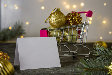 Blank christmas card on table and christmas decorations. Space for text