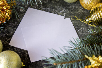 Blank christmas card on table and christmas decorations. Space for text