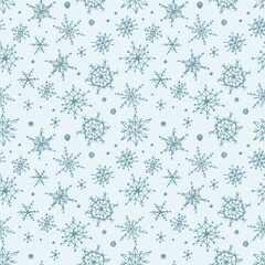 Seamless pattern with hand-drawn snowflakes.
