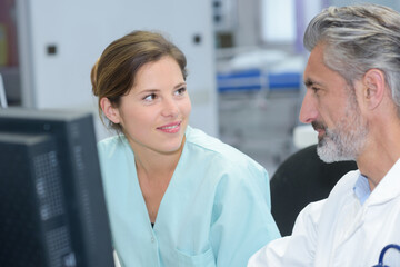 Obraz premium dentist and dental nurse flirting