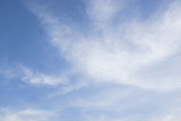White beautiful cloudy in clear blue sky.