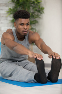 Handsome Young Man Doing Hamstring Stretch Exercise