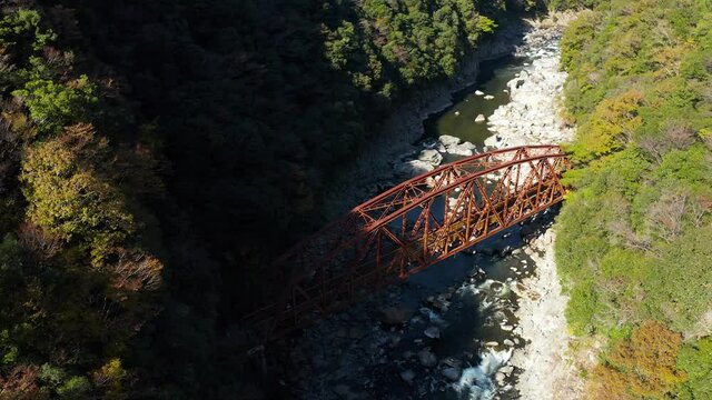 Old abandoned iron bridge on Fukuchiyama line in Autumn, Japan