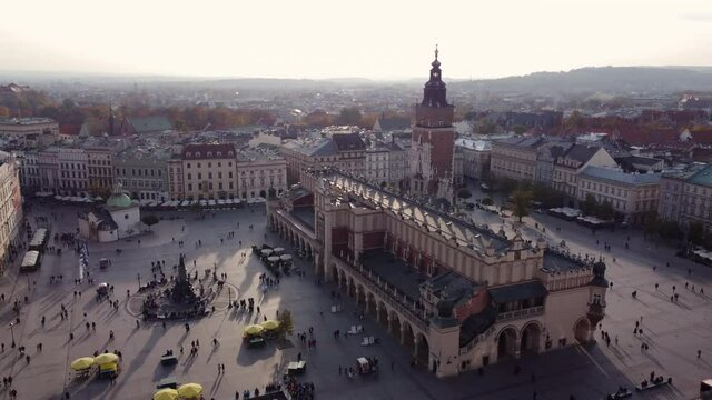 Main Market Square With Cloth Hall (Sukiennice) And Town Hall Tower In Krakow City, Poland. - aerial