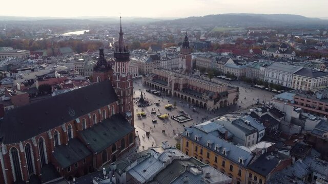 Aerial View Of Main Market Square (Rynek Glowny) With Saint Mary&rsquo;s Basilica, Adam Mickiewicz Monument, Cloth Hall, And Town Hall Tower In Krakow, Poland.