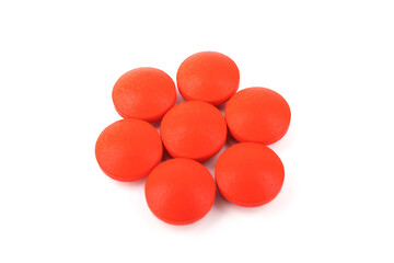 Red pills on a white background, isolated. Pharmacy. Treatment.