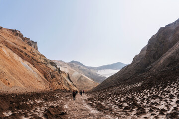 Hike of tourists to the Mutnovsky volcano. Smoking fumarole field. South Kamchatka Natural Park, Kamchatka Territory, Russia © Valeria Mas